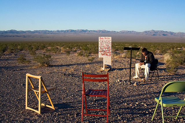 itinerant preacher obsessed with the absurd preparing to preach in the middle of nowhere